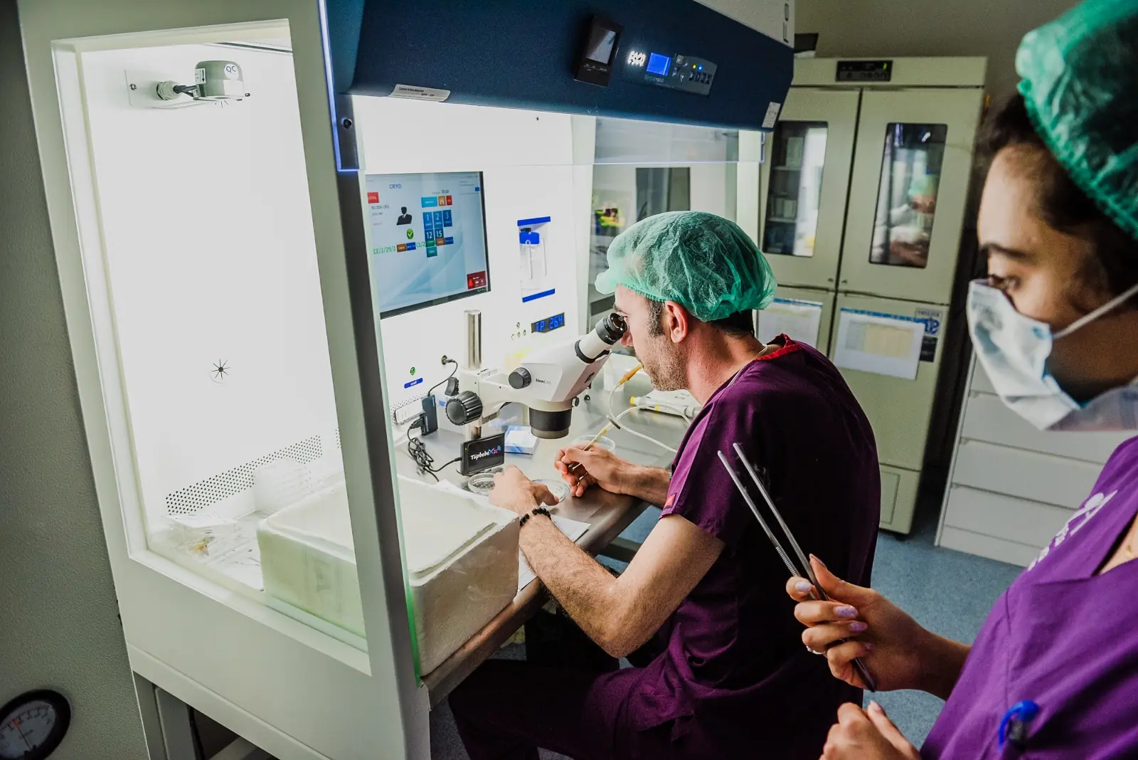 Vita Altera IVF embryologist working at a microscope